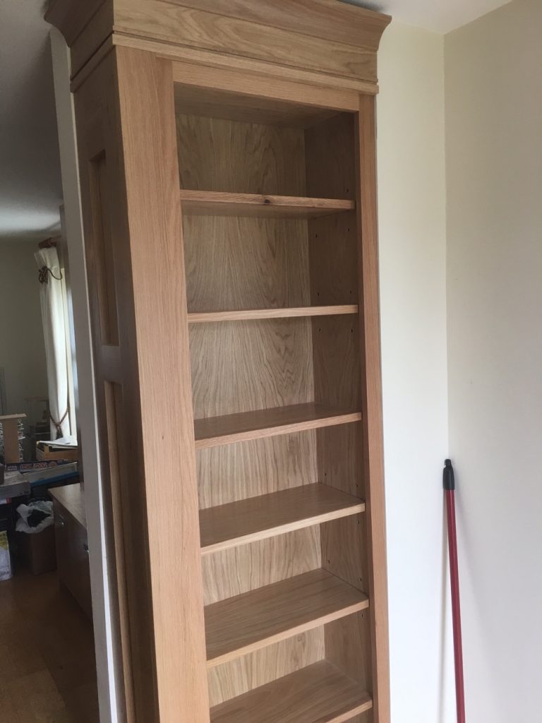 floor to ceiling bookcases in the dining room