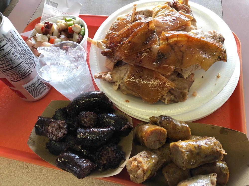 Lechón, morcilla and pork sausage at a lechonera in Puerto Rico