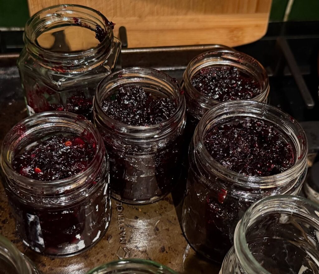 Spiced blackberry and apple jam in jars